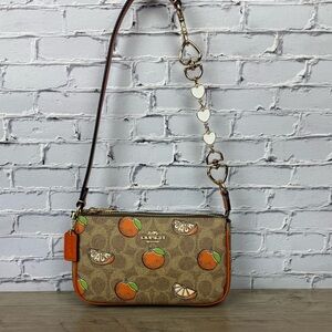 NWT Coach Nolita 19 With Orange Print with a free unbranded chain extender CAL27